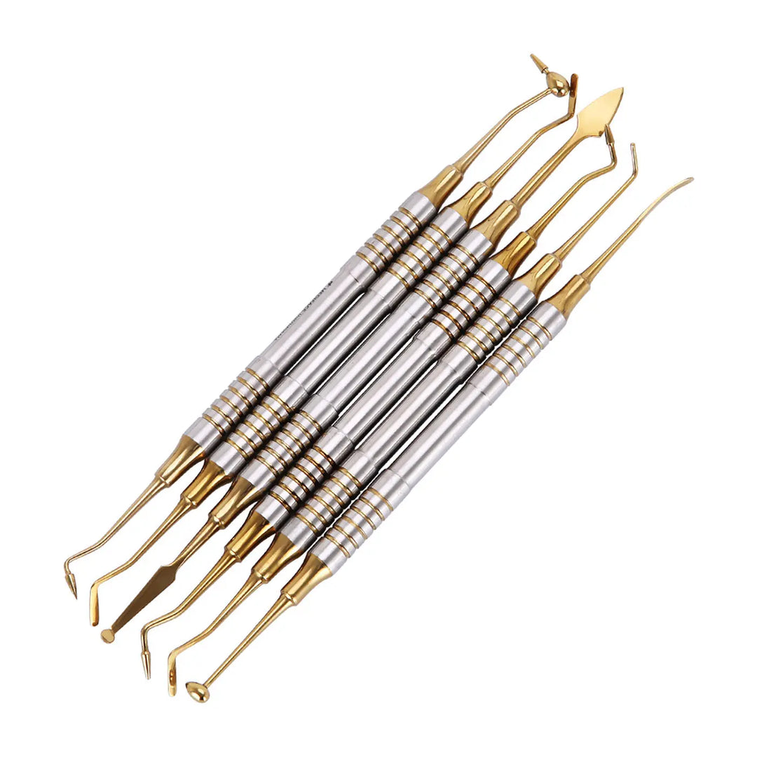 Dental Tools Composite Resin Filling Spatula Titanium Plated Head Filler Gold - Set of 6 stainless steel dental instruments with gold-colored titanium plated tips for precise composite resin filling and burnishing, featuring textured grips and various shaped ends for different dental procedures