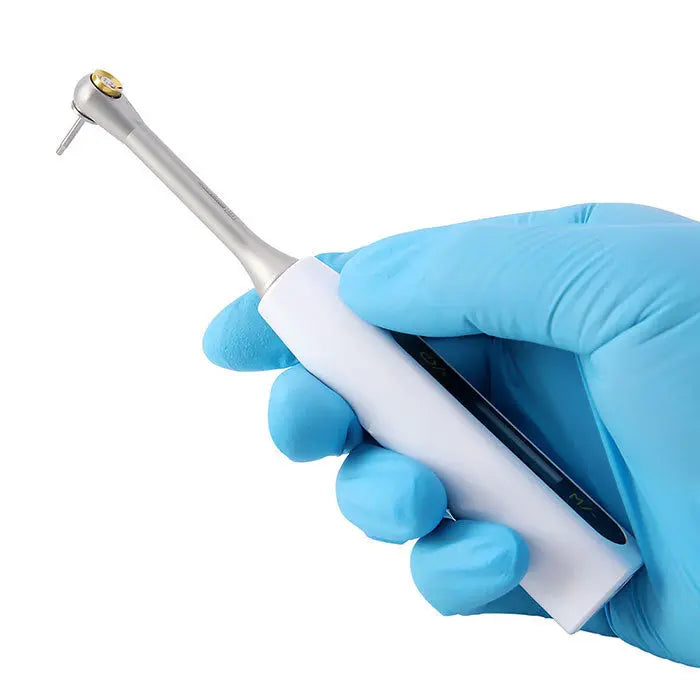 Dental Universal Implant Driver Kit: Electronic torque wrench component held by gloved hand, demonstrating precision and hygiene in dental implant procedures. Stainless steel and white plastic construction visible.