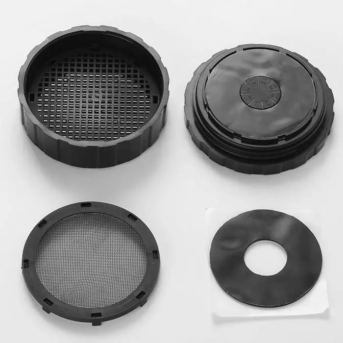 Dental Veneer Pretreatment Patch Tooth Box components: black circular base with grid pattern, lid with sunburst design, mesh filter, and ring-shaped insert for secure storage and protection of dental veneers