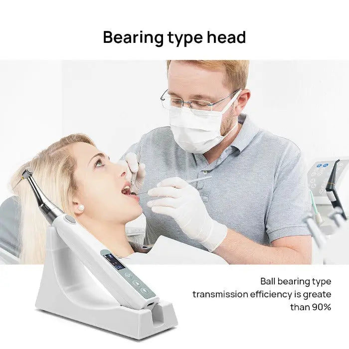 Dental Wireless Endo Motor With Builtin Apex Locator: Dentist using bearing type head with ball bearing transmission for efficient dental procedure on patient in dental chair, demonstrating high-precision dental equipment