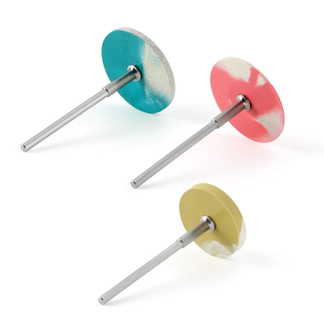 Dental Rubber Diamond Polisher Wheel Disc For Porcelain Coarse/Medium/Fine in blue, red, and yellow colors with metal shanks. High-quality dental laboratory tools for efficient porcelain and zirconia restoration polishing.