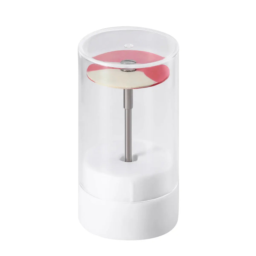 Dental Rubber Diamond Polisher Wheel Disc For Porcelain Coarse/Medium/Fine displayed in a clear cylindrical case. The disc is pink and white, mounted on a metal shaft, showcasing its compact size and professional-grade design for dental laboratory use.