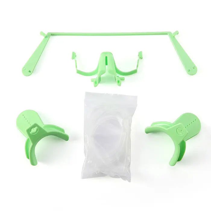 Dental Adjustable Orthodontics Nola Cheek Retractor With Dry Field System White/Green components displayed: green plastic frame, tongue guard, cheek retractors, and sealed white package, showcasing the complete kit for dental procedures and patient comfort