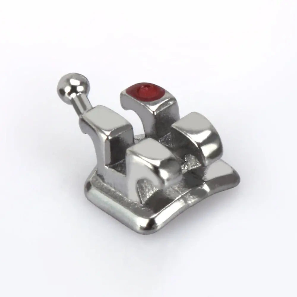 Dental Metal Brackets MIM Monoblock Mini MBT 0.022 Hooks on 345 20pcs/Kit: Close-up of a single metal orthodontic bracket with a red color-coded identifier, featuring a smooth rounded design and integrated ball hook for maximum strength and patient comfort.