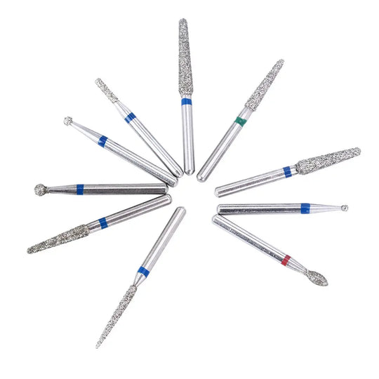 100pcs Dental Diamond Burs FG 1.6MM 20 Model/Kit displayed in a circular arrangement. Various sizes and shapes of diamond-coated dental burs with metal shafts and colored bands, used for high-speed handpieces in dental procedures.