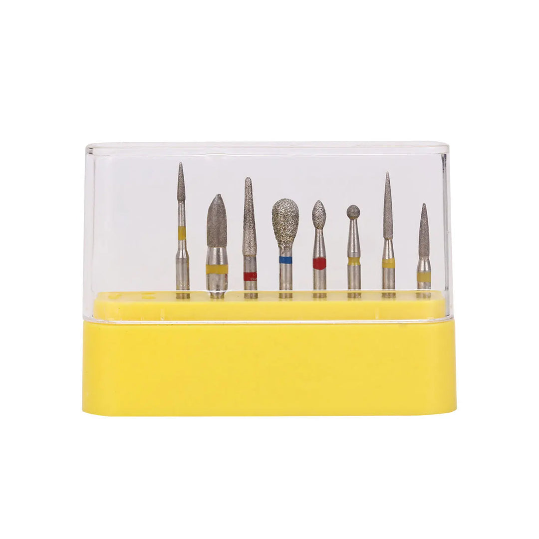 Dental Diamond Bur FG-114 Composite Resin Kit 8pcs/Kit displayed in yellow-based plastic case with clear lid, showing 8 different diamond-tipped dental burs for composite resin preparation, each with distinct shapes and color-coded bands