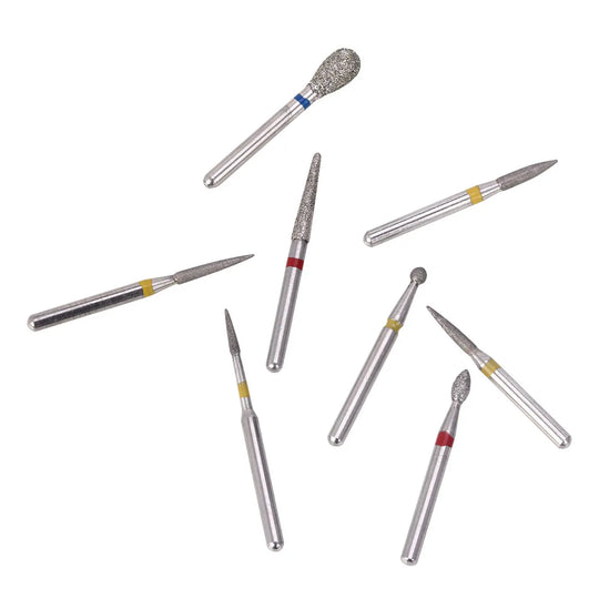 Dental Diamond Bur FG-114 Composite Resin Kit 8pcs/Kit: Set of eight silver dental diamond burs with varied tip shapes and colored bands, used for composite resin preparation in dentistry. Professional-grade tools for precise dental work.