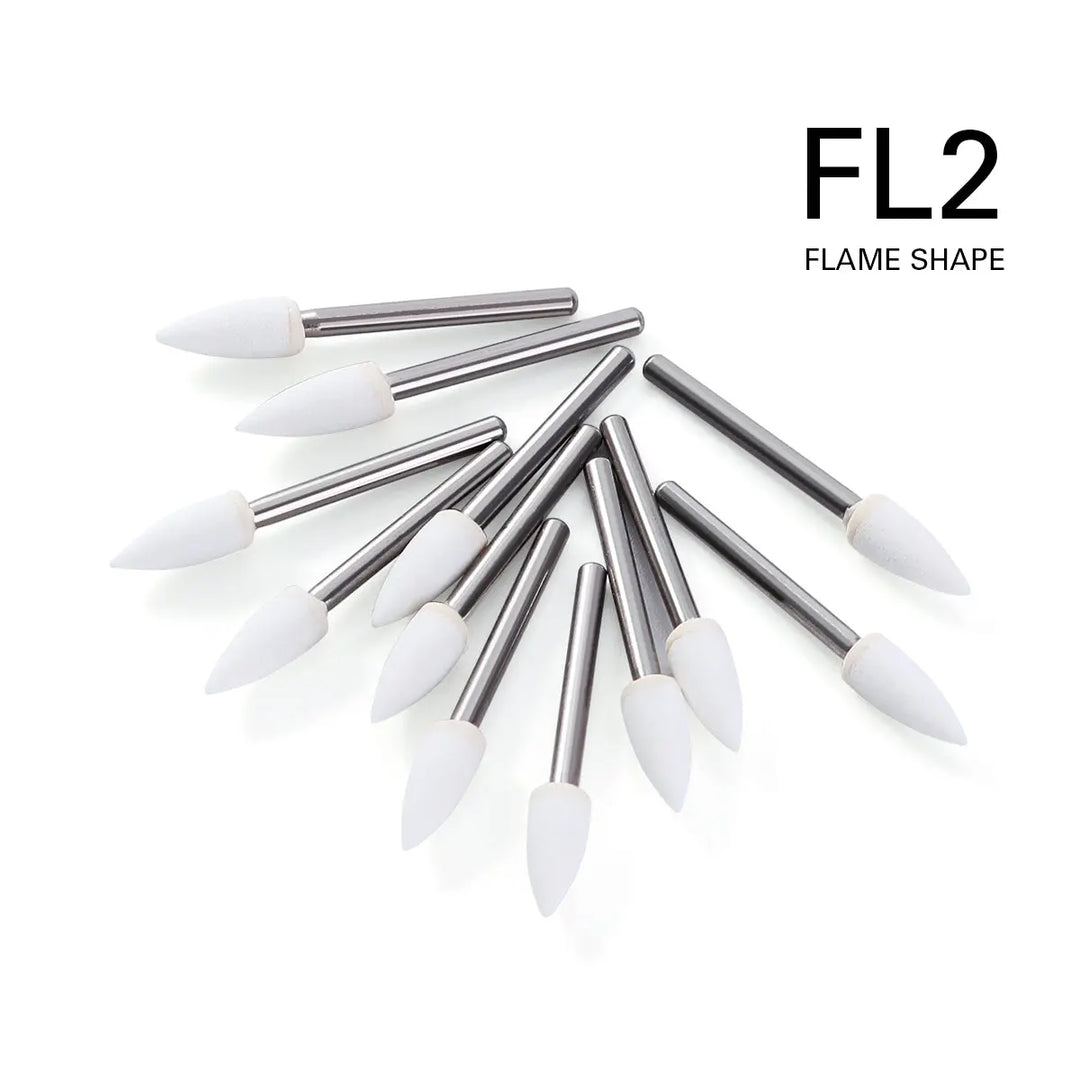 Dental Polishing FG Burs Flame Shape White Stone 12pcs/Kit displayed in a fan arrangement. Metal shafts with white flame-shaped tips, labeled FL2 Flame Shape. High-quality aluminum oxide material for efficient dental polishing.