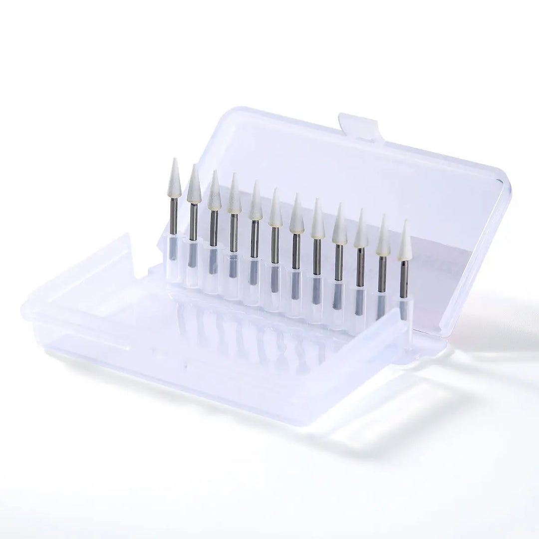 Dental Polishing FG Burs Cone Shape White Stone 12pcs/Kit displayed in a clear plastic case, showing white cone-shaped burs with metal shanks arranged neatly in a row, ideal for dental polishing procedures