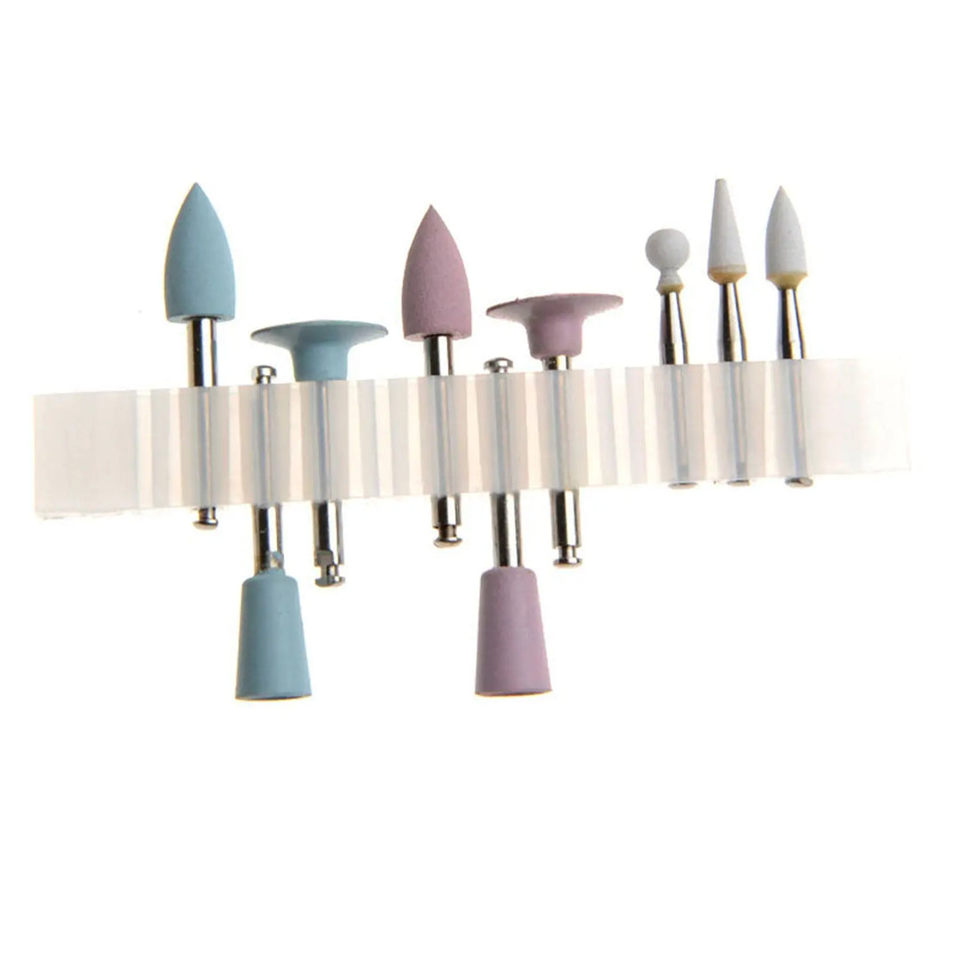 Dental Composite Polishing Kit RA 0309 9pcs/Kit displayed on a white stand, showing assorted polishing tools in pastel blue, pink, and white colors with various shapes including pointed, cone, ball, cup-shaped, and knife wheel for different dental polishing stages.