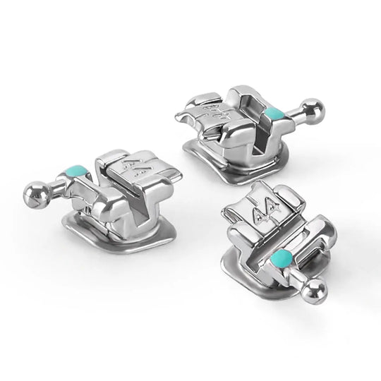 Dental Metal Self-Ligating Brackets Mini Roth.022 Hooks 345 24/Kit: Close-up of three silver orthodontic brackets with teal color-coding, featuring double wings, locking slots, and smooth surfaces for patient comfort. Designed for precise tooth alignment in dental procedures.