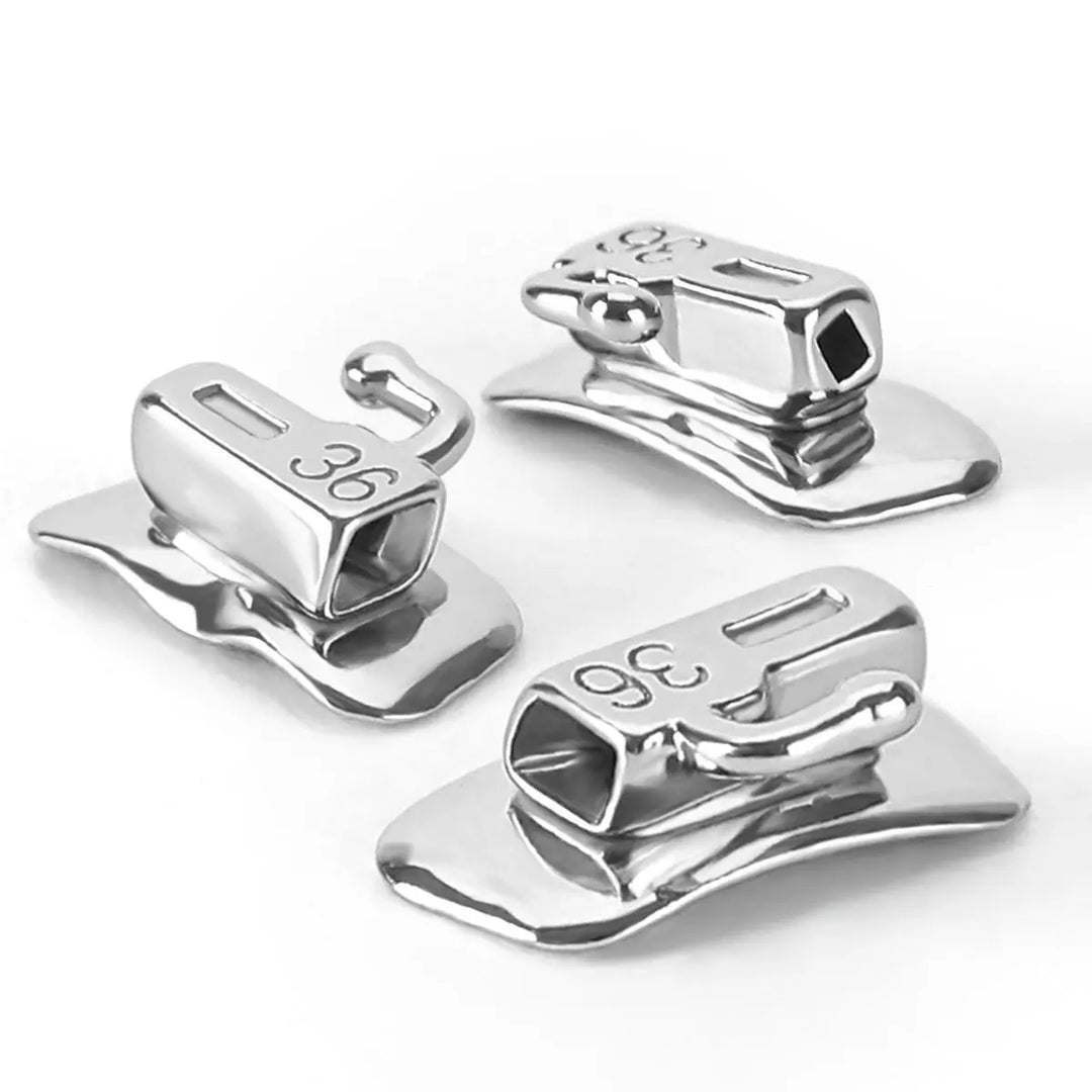 Dental Metal Self-Ligating Brackets Mini Roth.022 Hooks 345 24/Kit: Close-up of three shiny silver-colored orthodontic brackets with engraved numbers, showcasing their self-ligating design, double wings, and smooth surfaces for patient comfort.