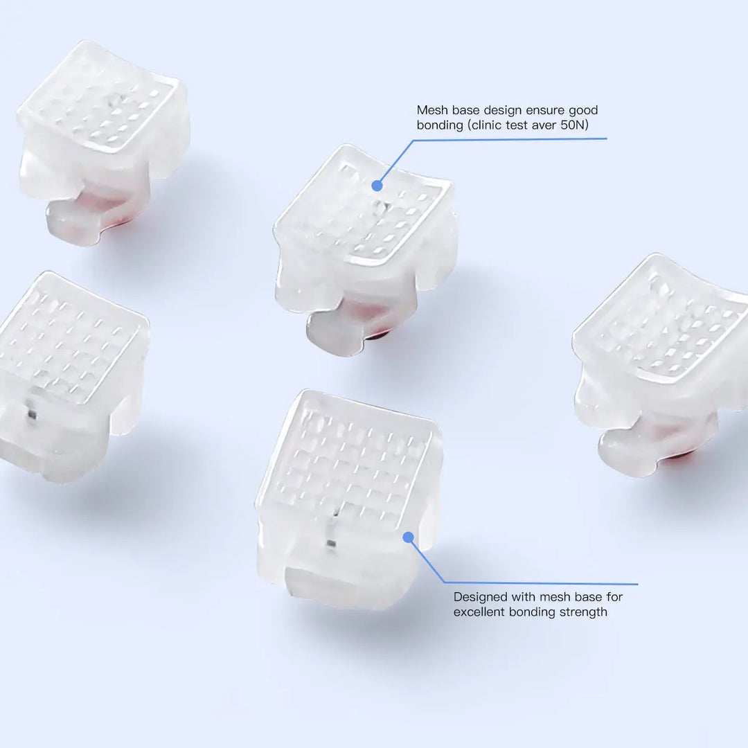 Dental Self-ligating Ceramic Brackets Clear Roth/MBT 0.022 with hook 3,4,5 - Close-up view of translucent ceramic orthodontic brackets with mesh base design for strong bonding, showcasing their low-profile and smooth edges for patient comfort