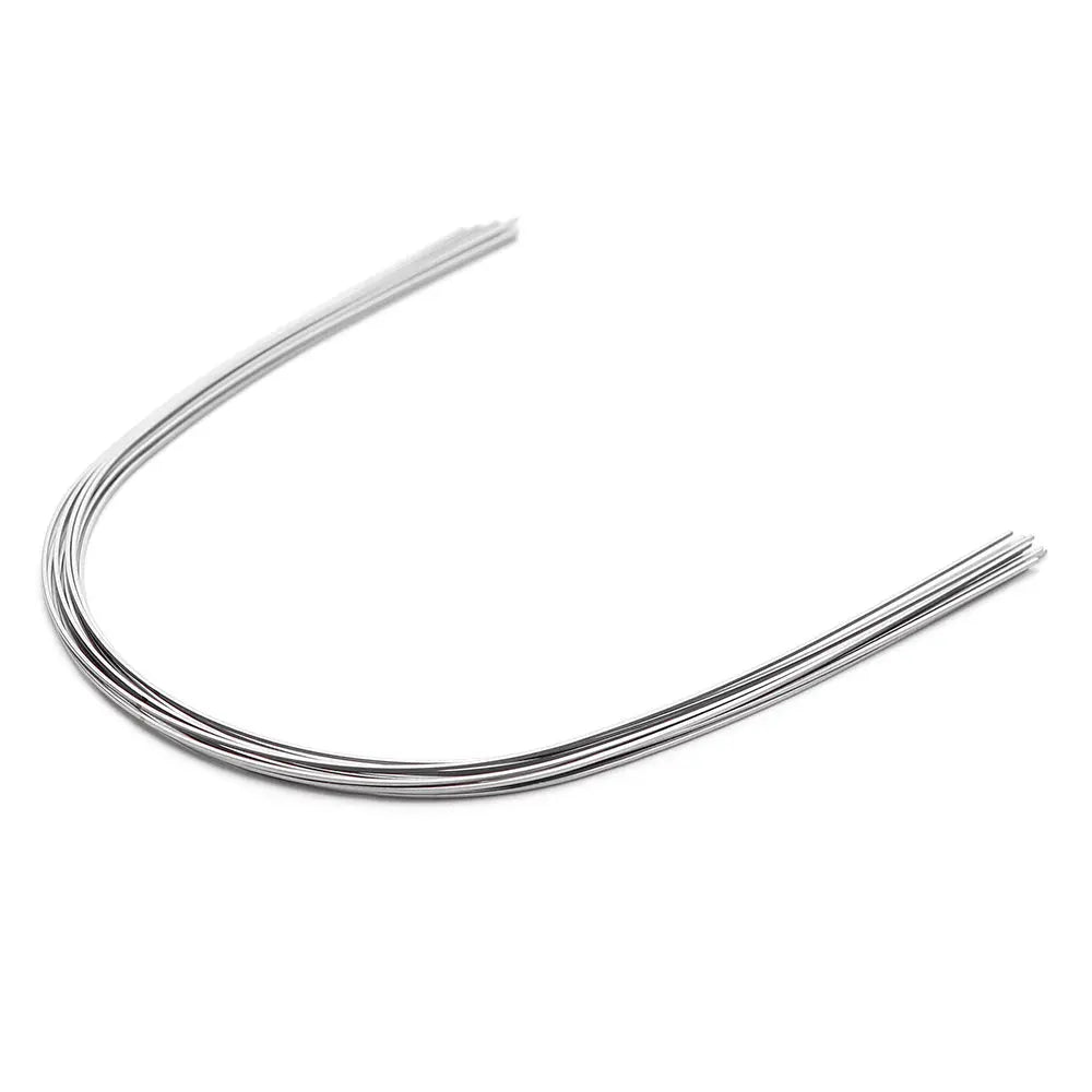 Archwire NiTi Super Elastic Natural Rectangular 0.018 x 0.025 Lower 10pcs/Pack: Curved, shiny metal orthodontic wire with natural form for lower teeth. Rectangular shape visible, designed to fit oral cavity space efficiently. Single wire shown, representing set of 10.