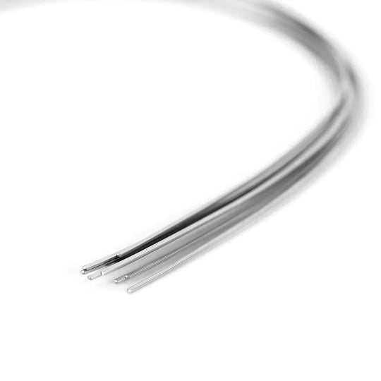 Close-up of Archwire Stainless Steel Natural Form Rectangular 0.018 x 0.022 Upper 10pcs/Pack, showing curved metal wires with smooth, shiny finish. Dental archwires displayed against white background, emphasizing their flexibility and natural arch shape for orthodontic use.