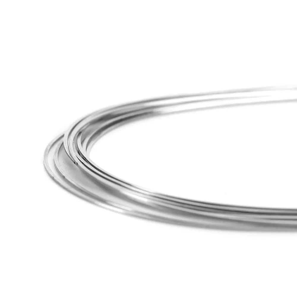 Archwire Stainless Steel Natural Form Rectangular 0.018 x 0.022 Upper 10pcs/Pack: Close-up of curved, shiny stainless steel wire with smooth surface and natural arch form, demonstrating flexibility and strength for orthodontic applications.