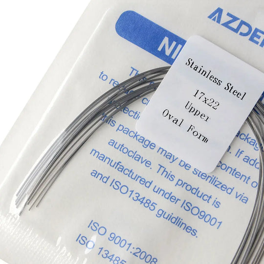 Archwire Stainless Steel Oval Form Rectangular 0.017 x 0.022 Upper 10pcs/Pack: Close-up of packaged dental orthodontic archwires with product label showing specifications. Curved stainless steel wires visible in clear packaging with blue and white labeling.