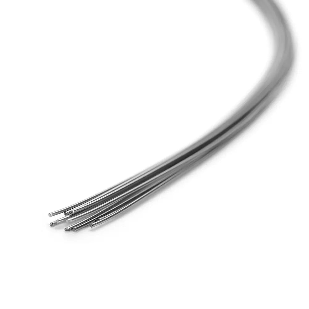 Arch Wire Stainless Steel Natural Form Round 0.014 Upper 10pcs/Pack: Close-up of thin, curved stainless steel wires with smooth, shiny surface, demonstrating flexibility and strength for orthodontic use in upper teeth alignment and space closure.