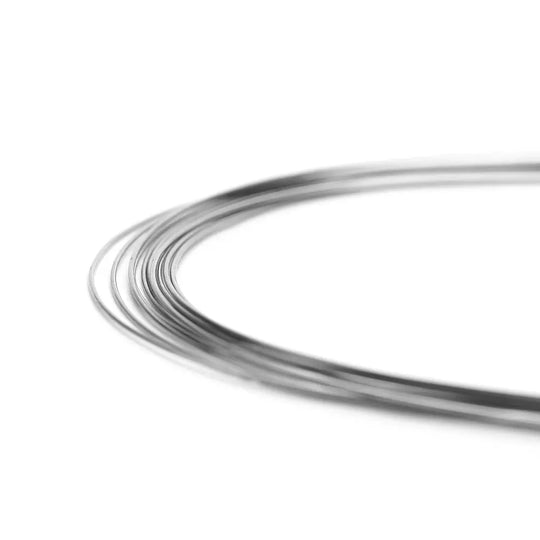 Close-up of Arch Wire Stainless Steel Natural Form Round 0.014 Upper, showing smooth, curved metallic wires with high luster finish, demonstrating flexibility and strength for orthodontic applications