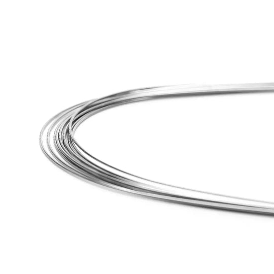 Archwire Stainless Steel Oval Form Round 0.012 Lower 10pcs/Pack - Close-up of curved, shiny stainless steel wire for dental orthodontic use, displaying flexibility and smooth finish ideal for lower teeth alignment and space closure