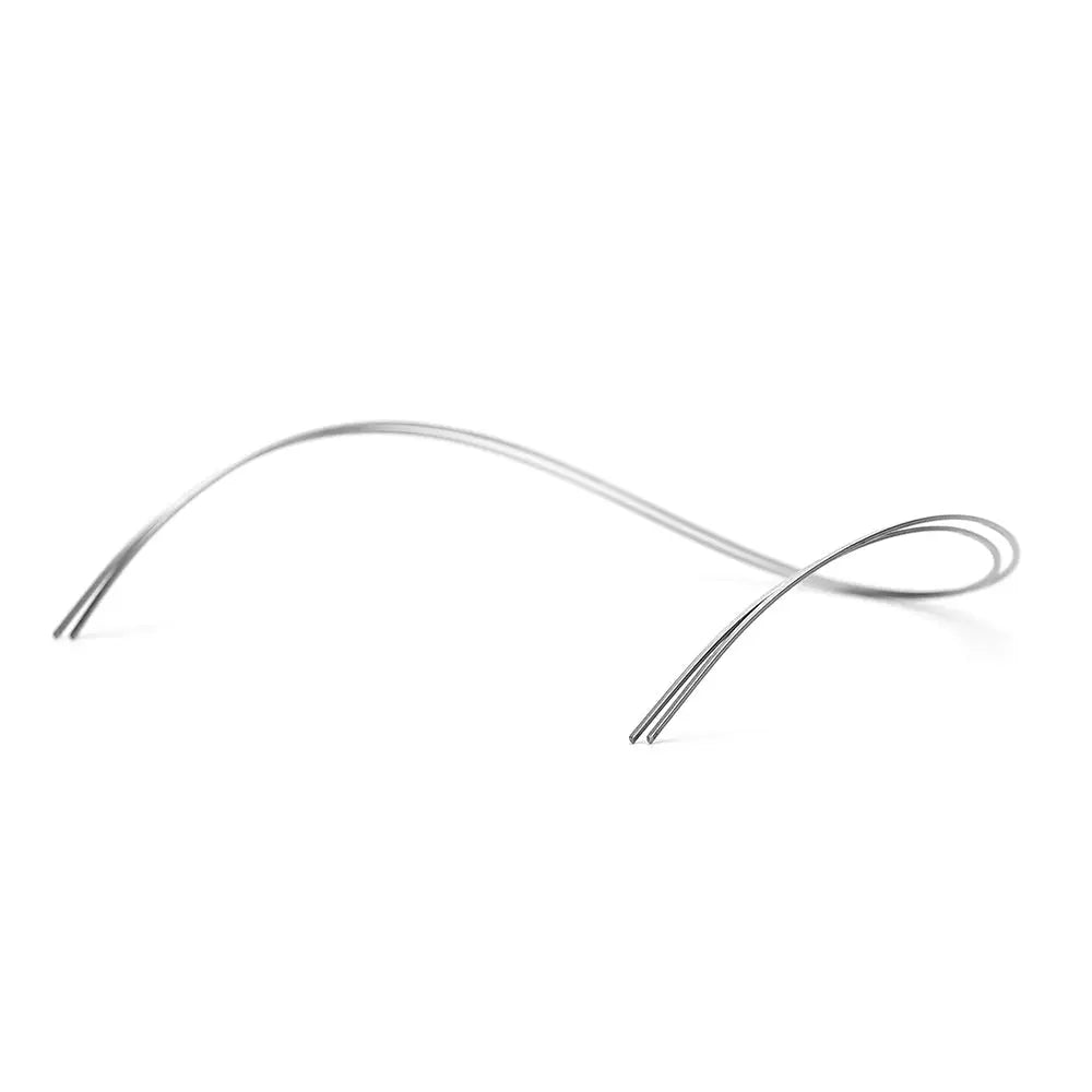 Archwire NiTi Reverse Curve True Form Rectangular 0.017 x 0.025 Lower 2pcs/Pack shown as a curved silver wire with tapered ends for dental orthodontic treatment, displaying its flexible and durable nature for effective tooth alignment