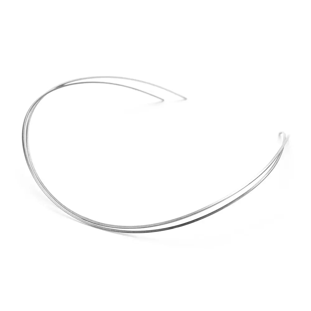 Archwire Niti Reverse Curve Rectangular 0.016 x 0.025 Upper 2pcs/Pack: Curved silver dental archwire made of NITI alloy, used for orthodontic treatment. The wire has a rectangular cross-section and is designed for upper teeth alignment.