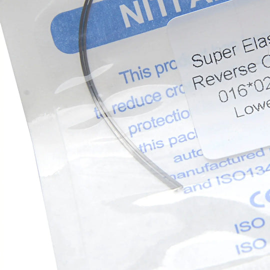 Close-up of Archwire Niti Reverse Curve Rectangular 0.016 x 0.025 Lower packaging, showing part of the product label with text describing its super elastic properties and reverse curve design for orthodontic use.