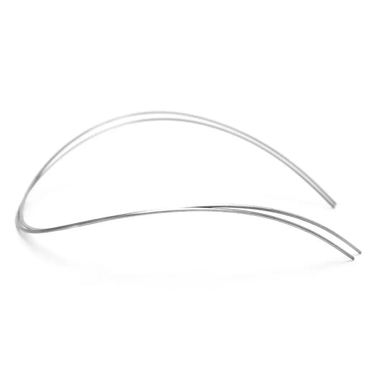 Archwire Niti Reverse Curve Rectangular 0.017 x 0.022 Upper 2pcs/Pack - Two thin, curved metal wires forming an arch shape against a white background, used for orthodontic treatment in dentistry