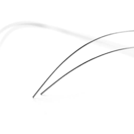 Archwire NiTi Reverse Curve Round 0.012 Lower 2pcs/Pack: Close-up of two thin, curved metal wires against a white background, showcasing the flexible and precise shape of dental archwires used in orthodontic treatments.