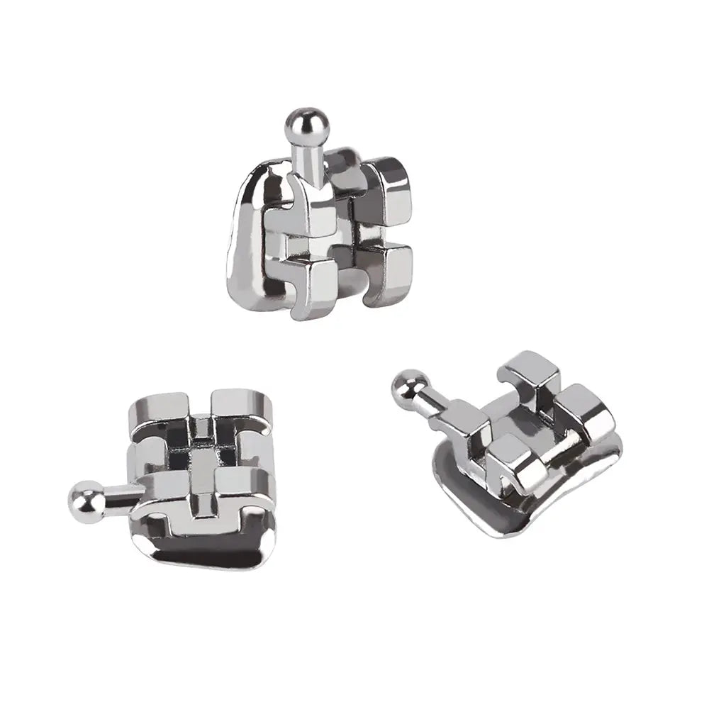 Dental Metal Brackets Mini Edgewise Slot .022 Hooks on 3 20pcs/Pack: Close-up of three shiny metal orthodontic brackets with hooks, showcasing intricate design and precision engineering for accurate teeth alignment and patient comfort