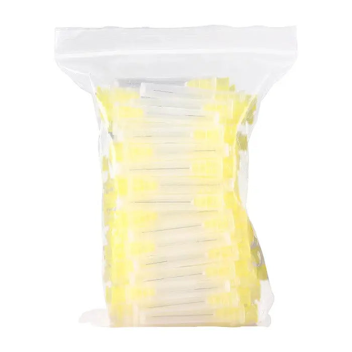 Dental Endo Irrigation Needle Tips for Root Canal, 100pcs/Pack in clear plastic bag. Yellow and white tips visible, showcasing various sizes and models for dental procedures. Compact packaging for convenient storage and use in dental practices.