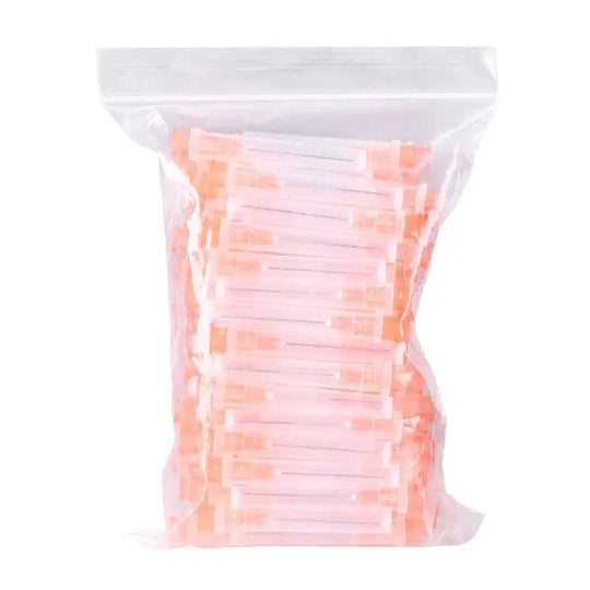 Dental Endo Irrigation Needle Tips for Root Canal, 100pcs/Pack in clear plastic bag. Various sizes of orange-tinted needle tips visible through packaging. Essential dental tool for precise root canal rinsing and material application.