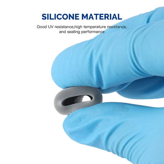 Dental Saliva Ejector Rubber Snap Tip Adapter held by gloved hand, showcasing silicone material properties. Close-up of gray circular adapter with hole, highlighting durability and UV resistance for dental procedures.