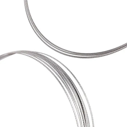 Dental Orthodontic Stainless Steel Lingual Retainer Wire Flat Straight Twist Wires 10pcs/Pack: Close-up of thin, shiny stainless steel wires coiled in circular shapes against a white background, showcasing the flexibility and length of the dental retainer wires.