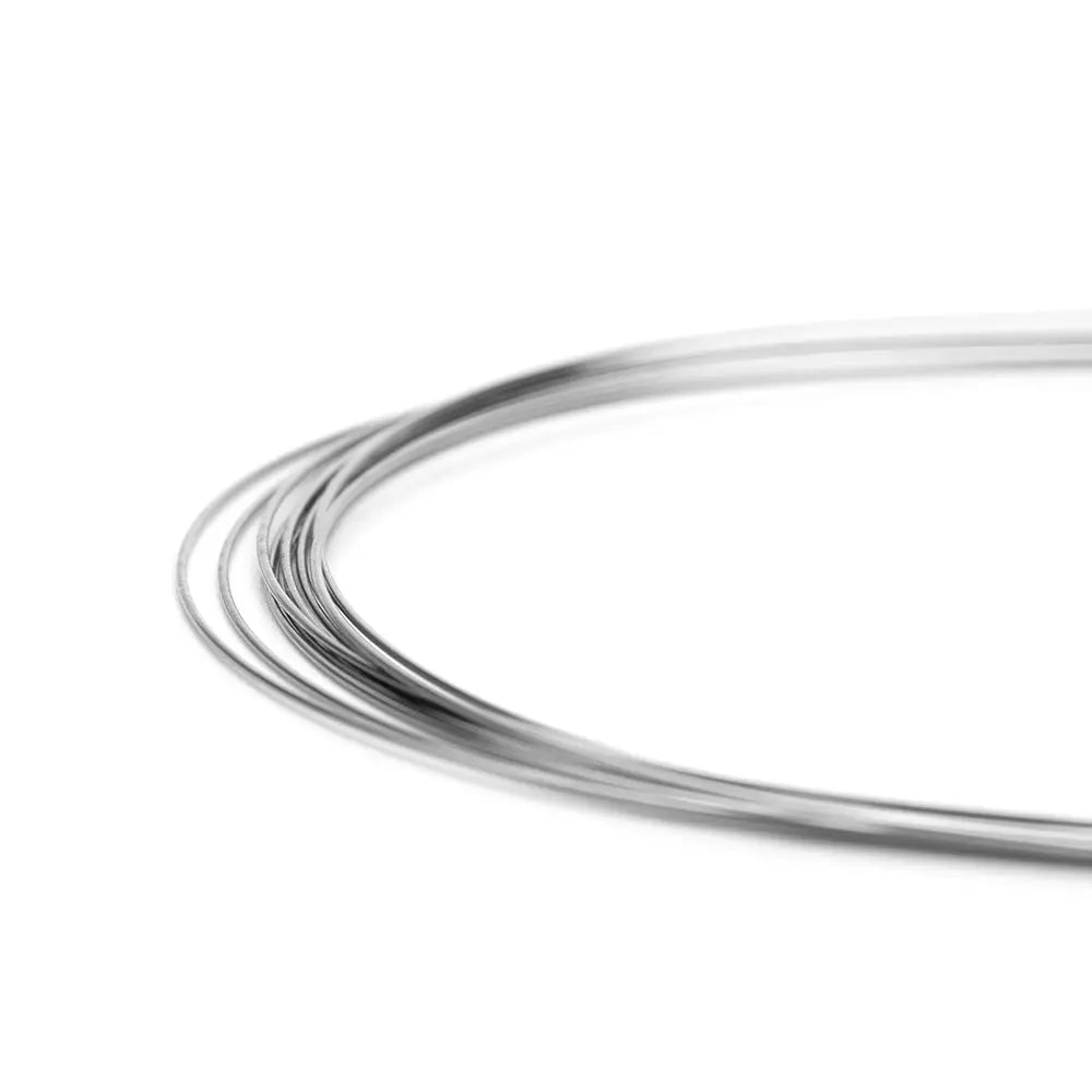 Close-up of Arch Wire NiTi Super Elastic Natural Round 0.016 Upper, showing curved, silver-colored dental orthodontic wire with smooth surface and natural arch form for optimal oral cavity fit and efficient treatment