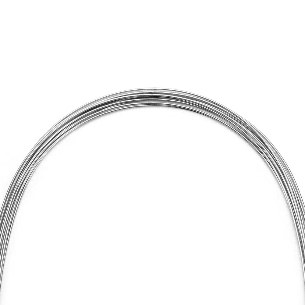 Arch Wire Stainless Steel Natural Form Round 0.016 Lower 10pcs/Pack: Coiled dental orthodontic wire with natural curvature, made of shiny stainless steel, for lower teeth alignment and space closure. Flexible yet strong, ideal for early leveling and torque control.