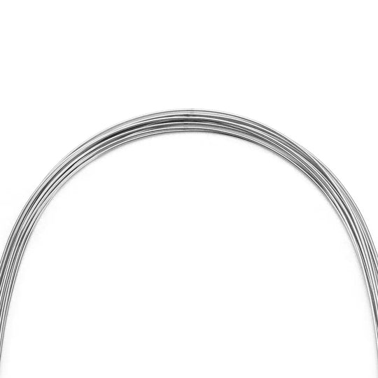 Arch Wire Stainless Steel Natural Form Round 0.016 Lower 10pcs/Pack: Coiled dental orthodontic wire with natural curvature, made of shiny stainless steel, for lower teeth alignment and space closure. Flexible yet strong, ideal for early leveling and torque control.