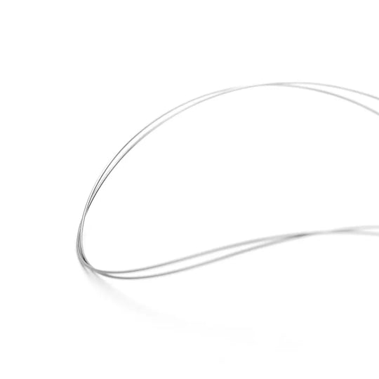 Arch Wire NiTi Reverse Curve True Form Round 0.018 Upper 2pcs/Pack: Close-up of thin, curved metallic wire against white background, showcasing the precise shape and smooth surface of the orthodontic archwire used for dental treatments.