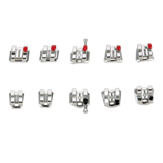 Dental Mini Metal Brackets For Braces Full Size 20pcs/Pack: Assorted orthodontic brackets displayed in two rows, featuring silver-colored metal construction with red accents. Various sizes and designs shown for different tooth positions, highlighting the product's versatility and precision in orthodontic treatment.