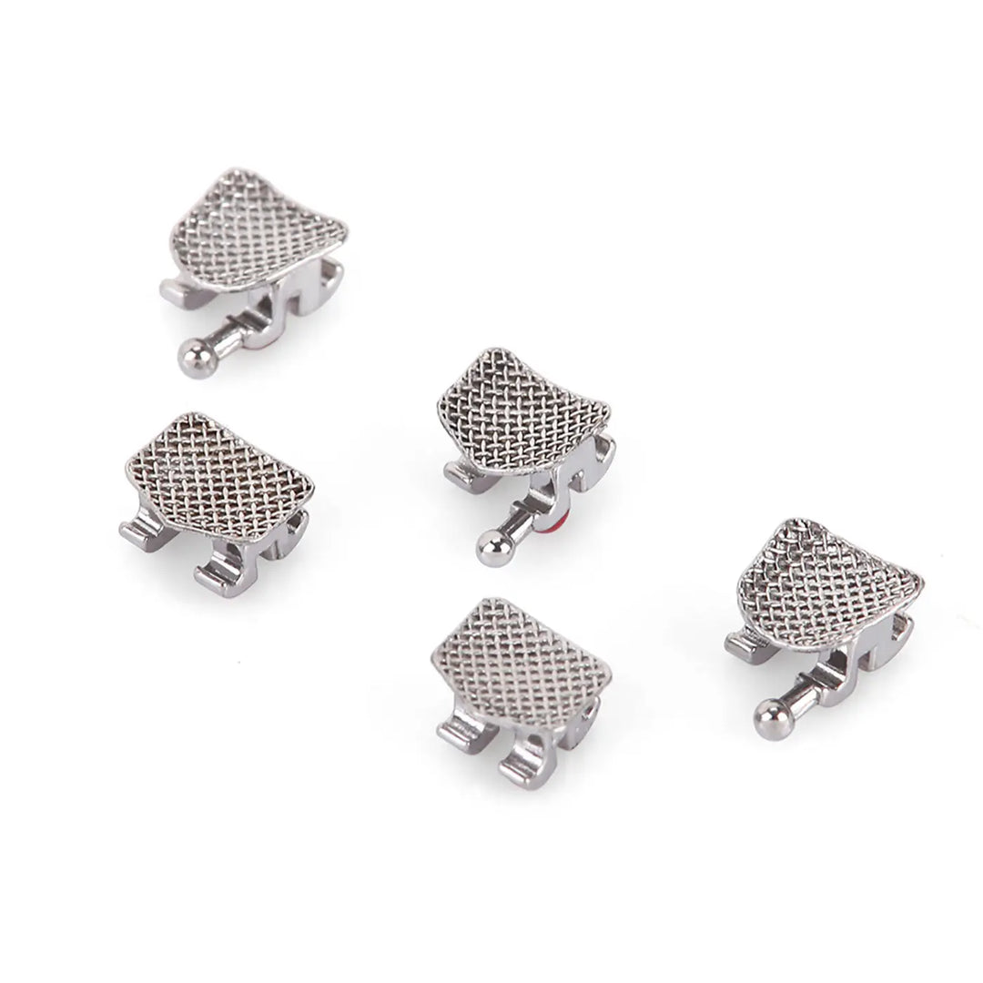 Dental Metal Brackets Mini Roth Slot .018 Hooks on 345 20pcs/Pack: Close-up of five silver-colored orthodontic brackets with mesh base and rhomboid shape, showcasing hooks and slots for archwire placement. Designed for accurate and comfortable teeth alignment.