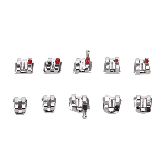 Dental Metal Brackets Standard Roth Slot .018 Hooks on 3 20pcs/Pk: Ten silver orthodontic brackets with red markers arranged in two rows. Each bracket features a metallic design with small openings and hooks for precise teeth alignment and wire attachment.