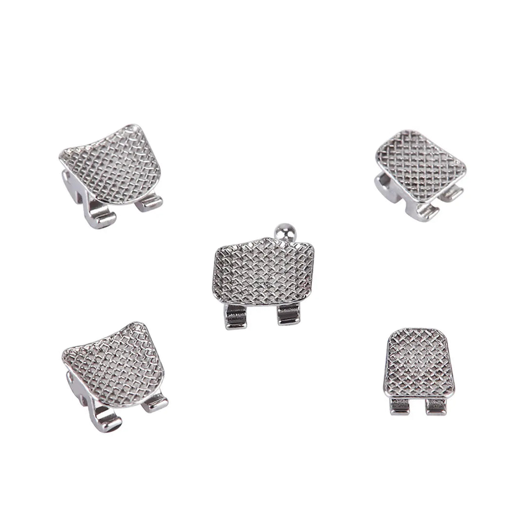 Dental Metal Brackets Standard Roth Slot .018 Hooks on 3 20pcs/Pk - Close-up of five silver orthodontic brackets with textured surfaces and small hooks, showcasing their square shape and mesh design for effective teeth alignment and wire attachment in dental procedures.