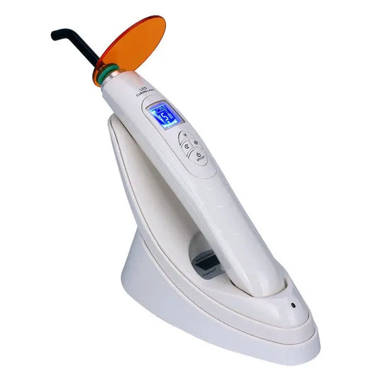 Dental LED Curing Light with built-in light meter, 380-515nm wavelength, 2000mW/cm² power, featuring LCD display, white handheld device with orange light shield, and charging base for dental procedures