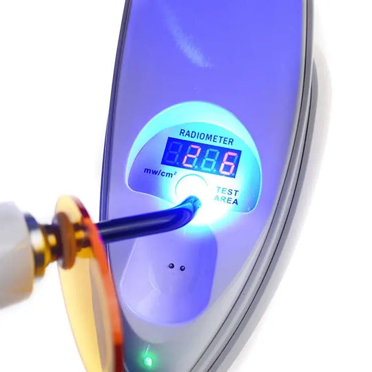 Dental LED Curing Light with built-in radiometer displaying 288 mW/cm² intensity, featuring a test area and blue light emission for precise dental procedures, showcasing the device's 380-515nm wavelength and 2000mW/cm² capability